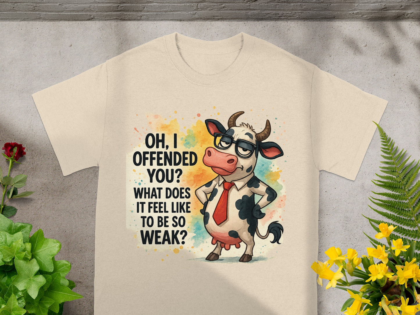Cream t-shirt with a cartoon cow wearing glasses and a tie, reading "OH, I OFFENDED YOU? WHAT DOES IT FEEL LIKE TO BE SO WEAK?"