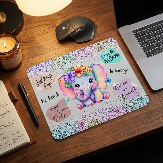 Cute elephant with flowers and inspirational quotes on a glittery mousepad.