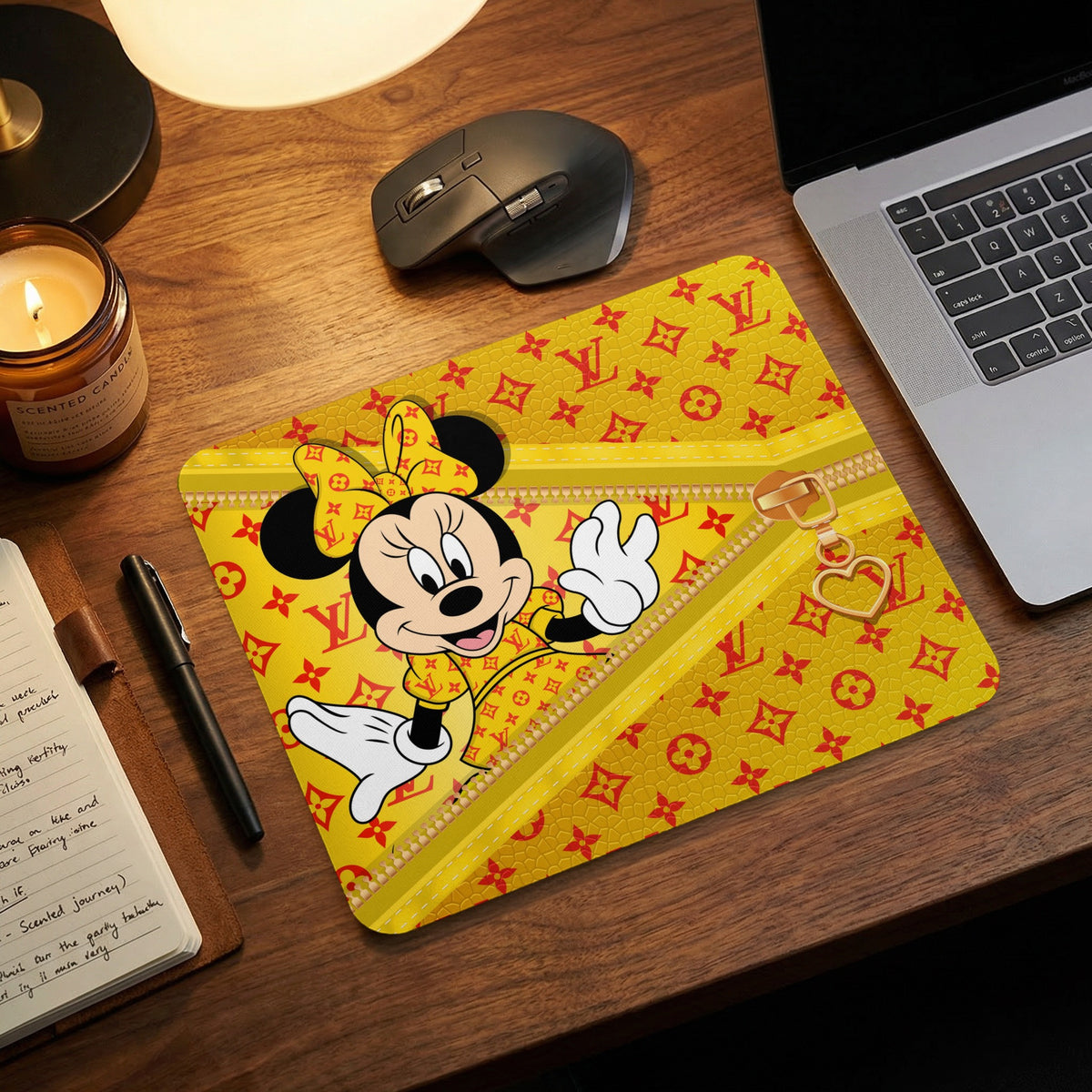 Minnie Mouse on a yellow mousepad with red monogram pattern and gold zipper detail.