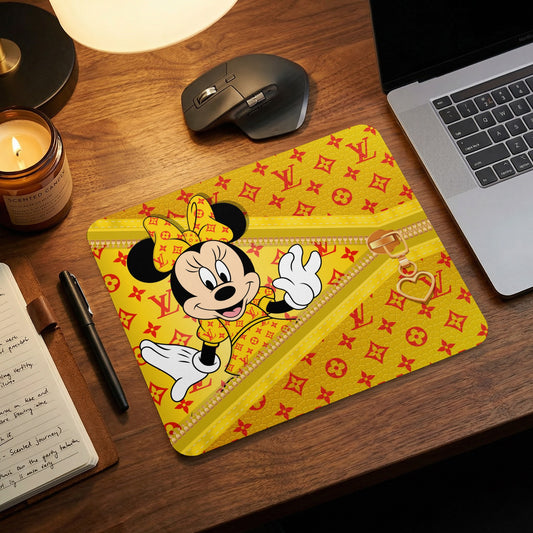 Minnie Mouse on a yellow mousepad with red monogram pattern and gold zipper detail.