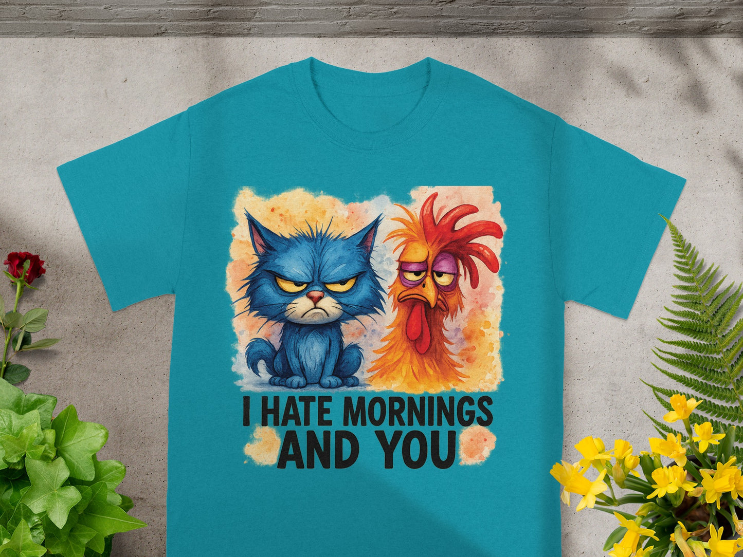 Teal t-shirt with grumpy cat and chicken graphic saying "I HATE MORNINGS AND YOU".