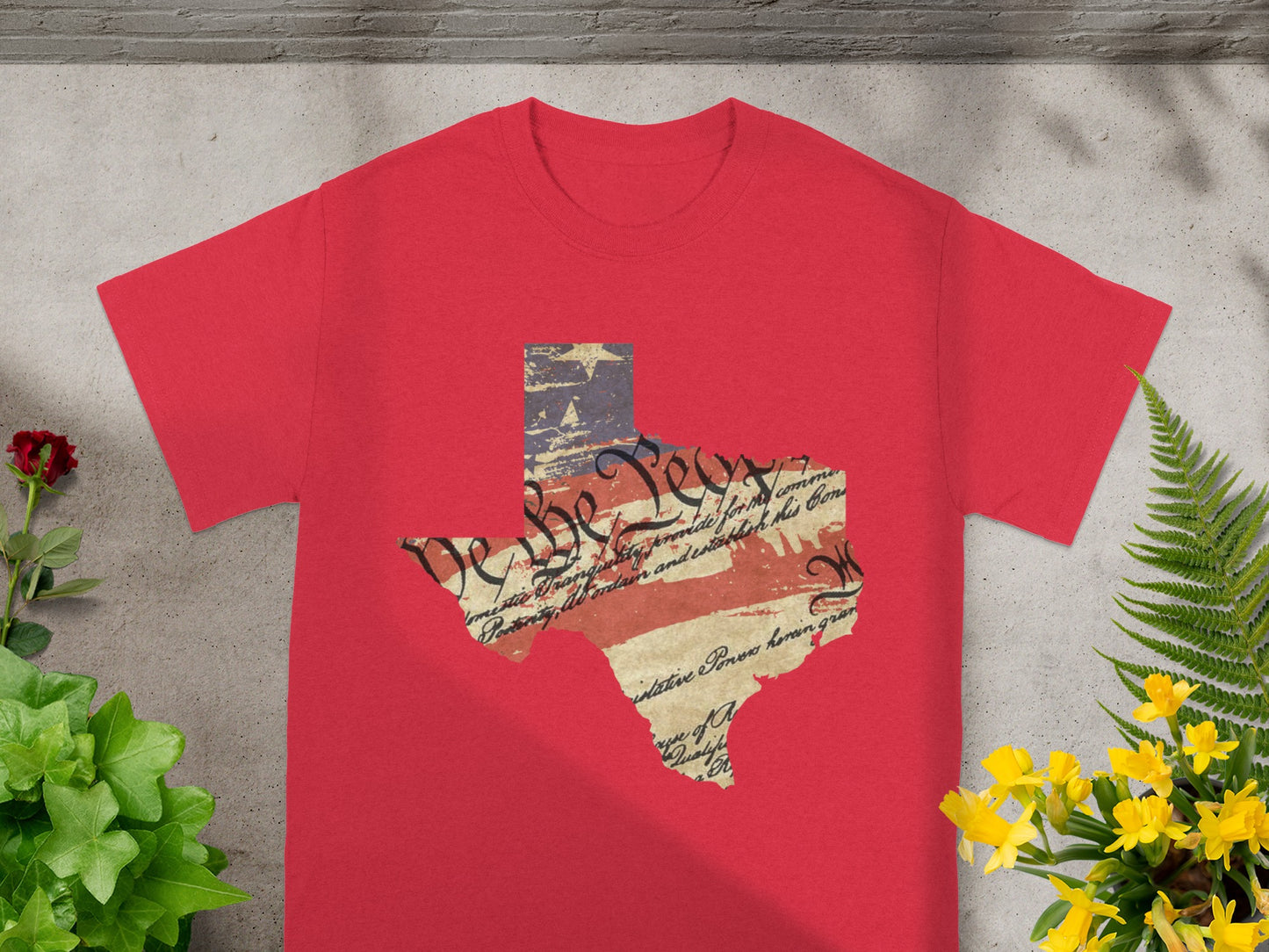 Red t-shirt with Texas outline featuring US Constitution text and flag pattern.