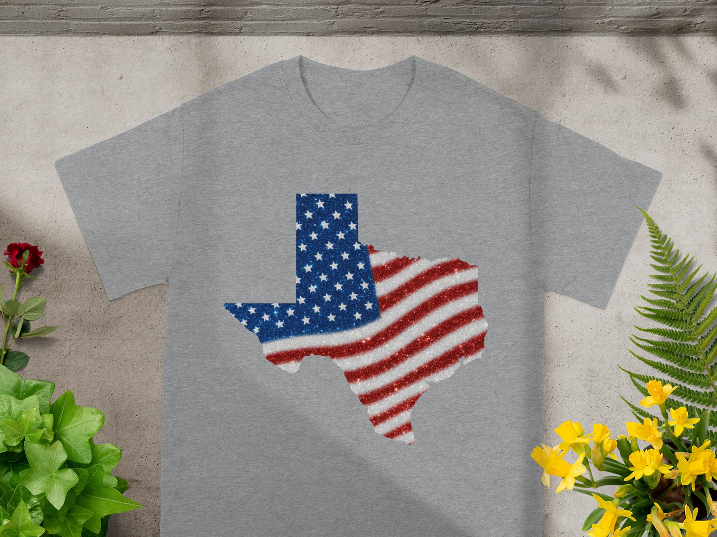 Grey t-shirt with a glitter Texas shape featuring the American flag design.