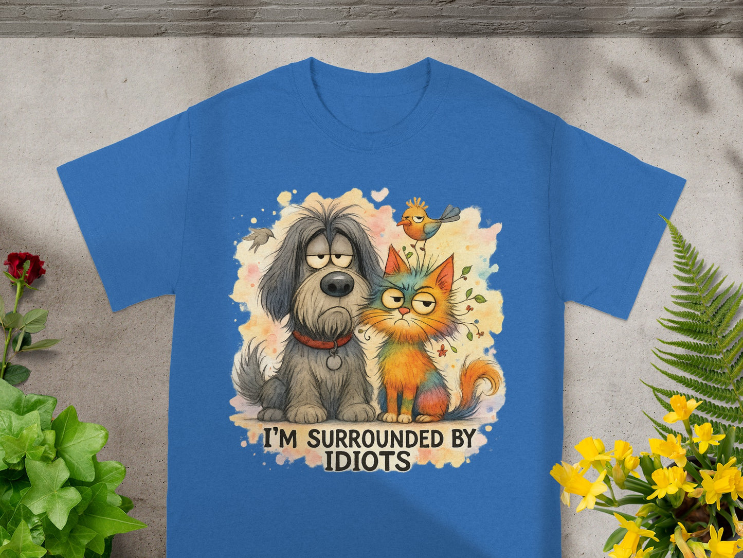 Blue t-shirt with cartoon dog and cat text "I'M SURROUNDED BY IDIOTS".