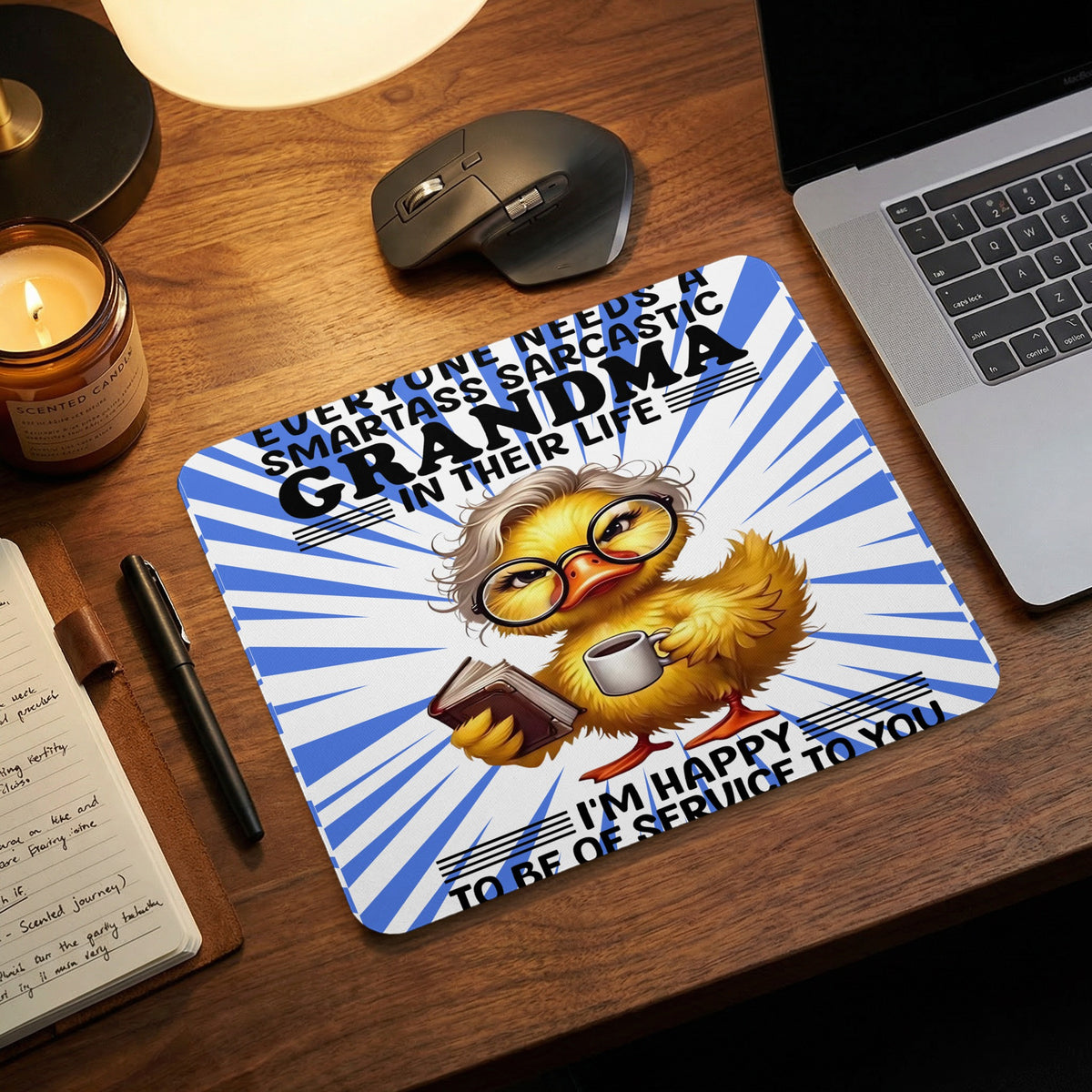 A rectangular mousepad featuring a cartoon duck with glasses holding a book and coffee mug.