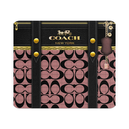 Coach New York logo on black leather with pink signature pattern and gold hardware.