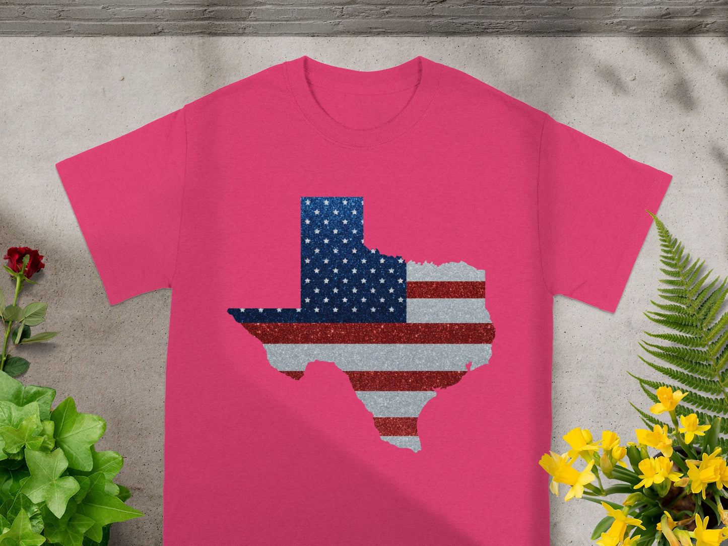 Pink t-shirt with Texas shape in glittery American flag design.