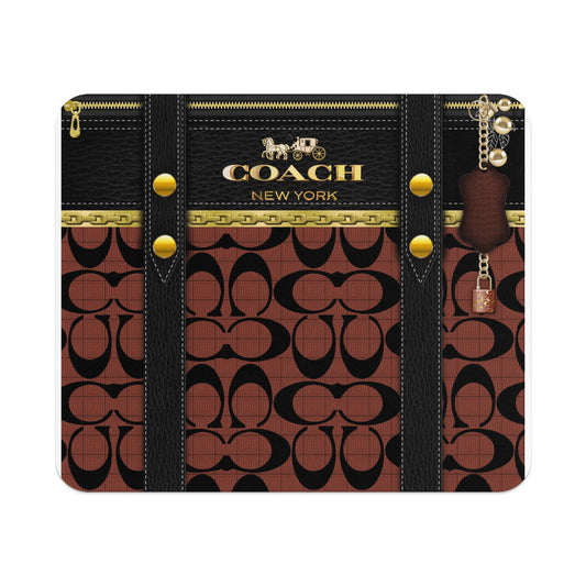 Coach New York brown signature pattern with black leather accents and gold hardware.