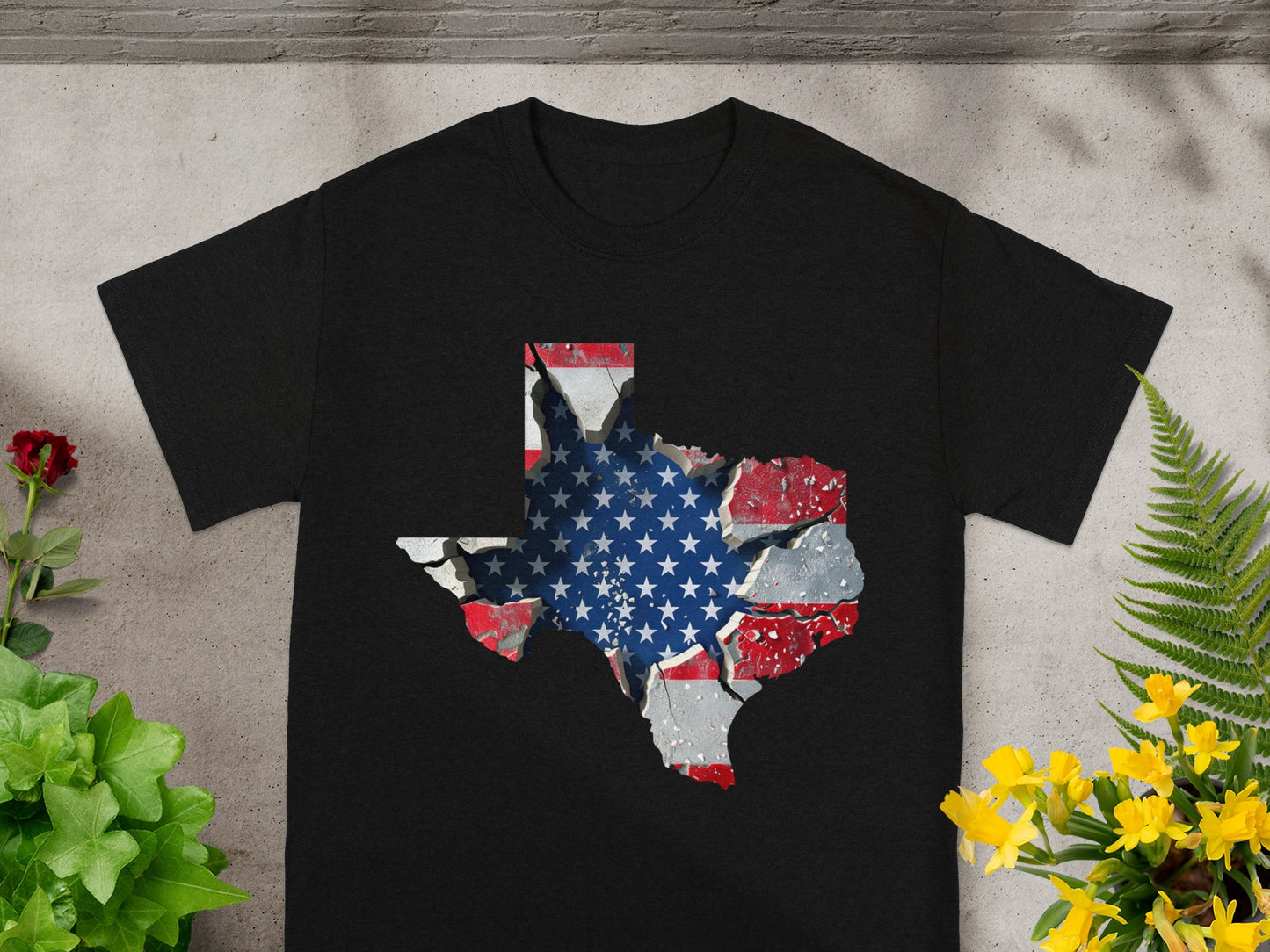 Black t-shirt with a cracked Texas map graphic featuring the American flag.