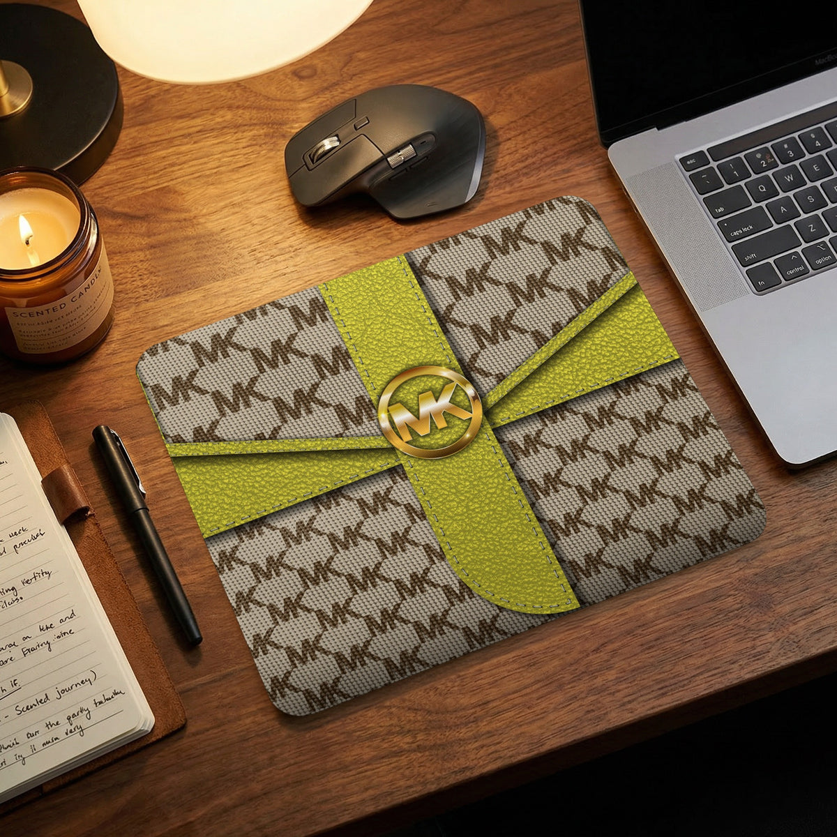 MK logo mousepad with yellow ribbon accents on a desk.