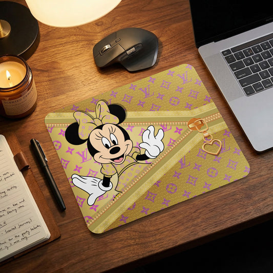 Minnie Mouse on a gold mousepad with purple pattern and gold zipper detail.