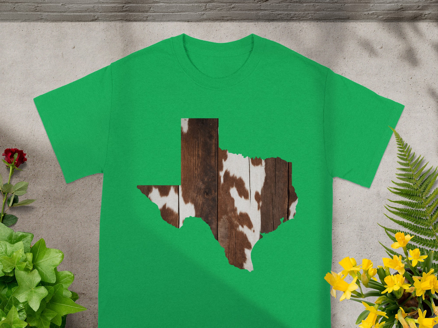 Green t-shirt with Texas shape featuring wood and cowhide texture.