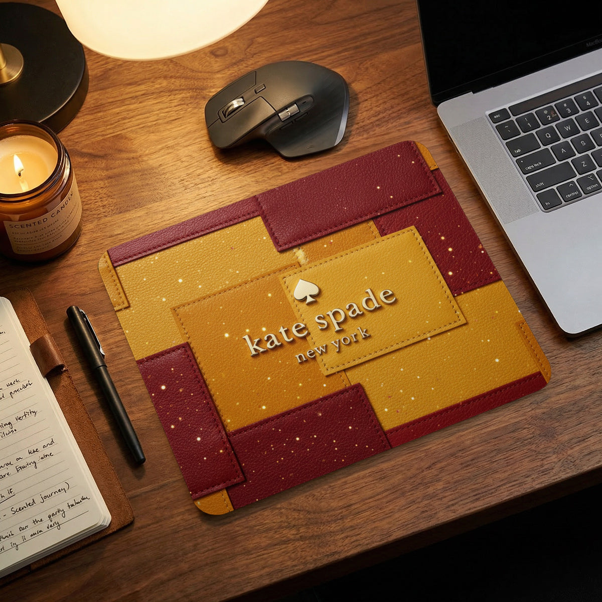 Kate Spade New York laptop sleeve with gold and red patchwork design.