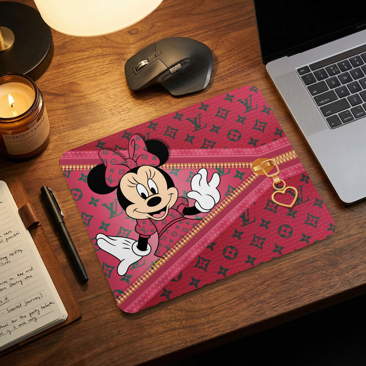 Minnie Mouse on a red mousepad with repeating monogram pattern and zipper detail.