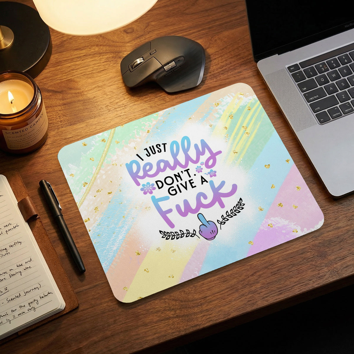 Pastel mousepad with the text I just really dont give a fuck on a wooden desk.
