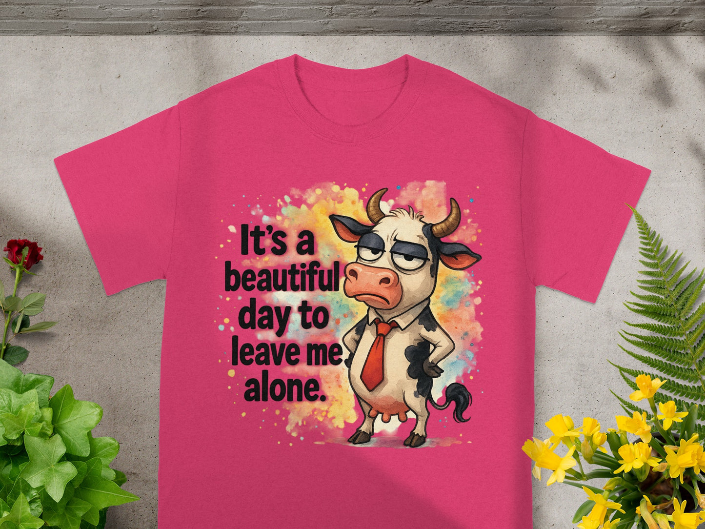 Pink t-shirt with cartoon cow saying "It's a beautiful day to leave me alone."