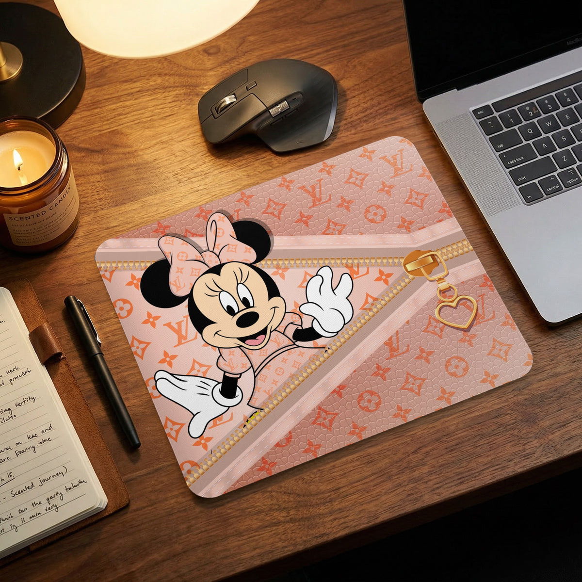 Minnie Mouse on a pink mousepad withLV pattern and zipper detail.