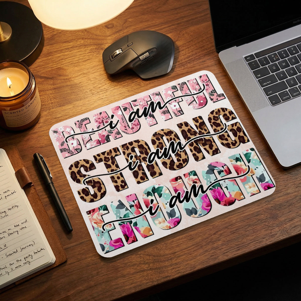 Mousepad with "I am strong" text in floral and leopard prints.