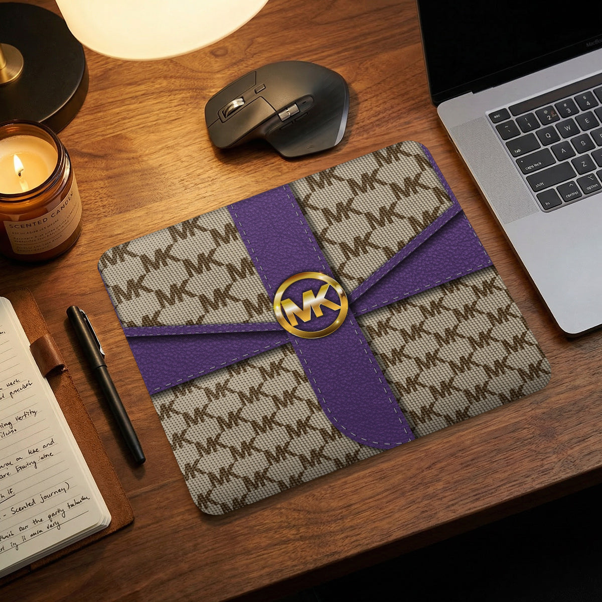 MK monogram clutch with purple ribbon detail and gold MK logo clasp.
