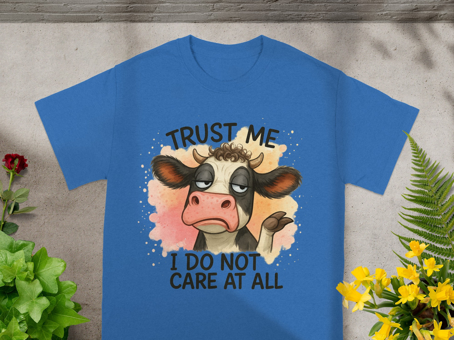 Blue t-shirt with cow graphic and text "Trust me I do not care at all".