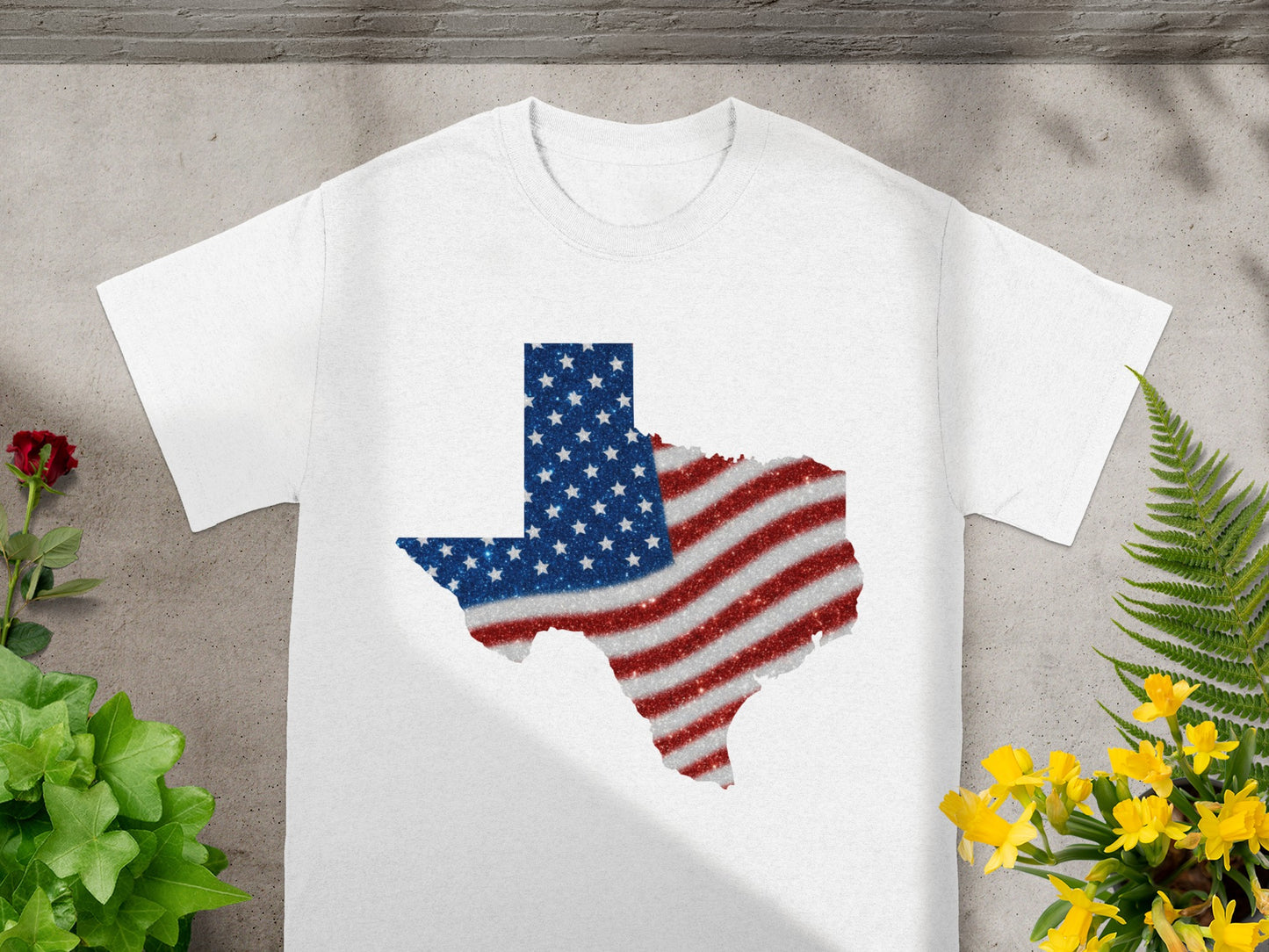 White t-shirt with a Texas outline filled with an American flag design.