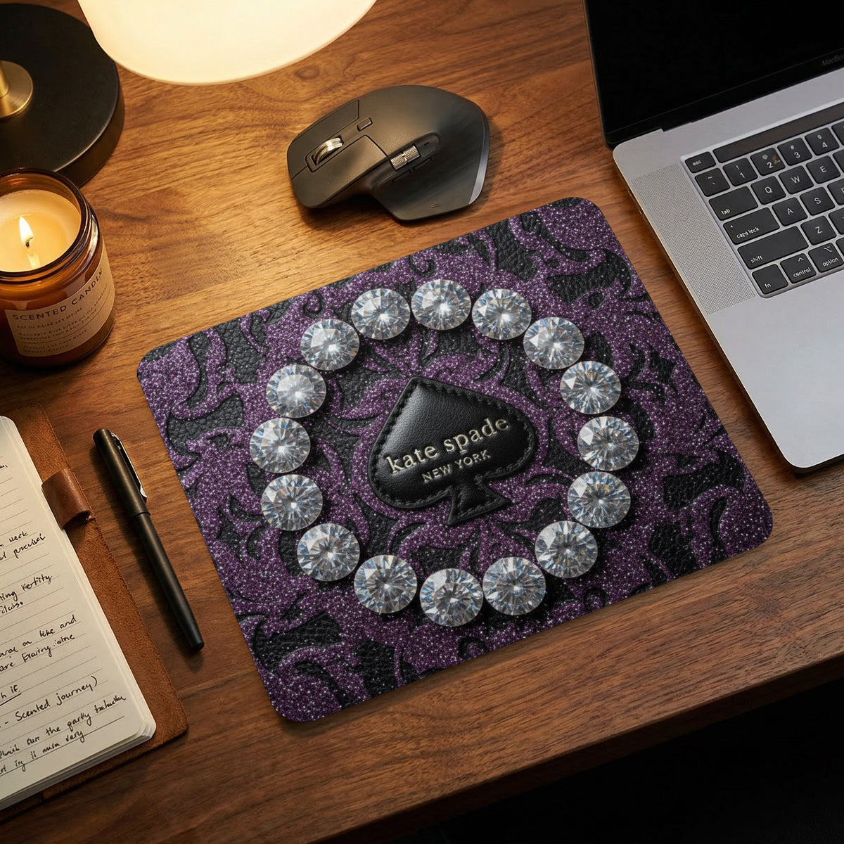 Kate Spade New York mouse pad with purple glitter and round rhinestones.