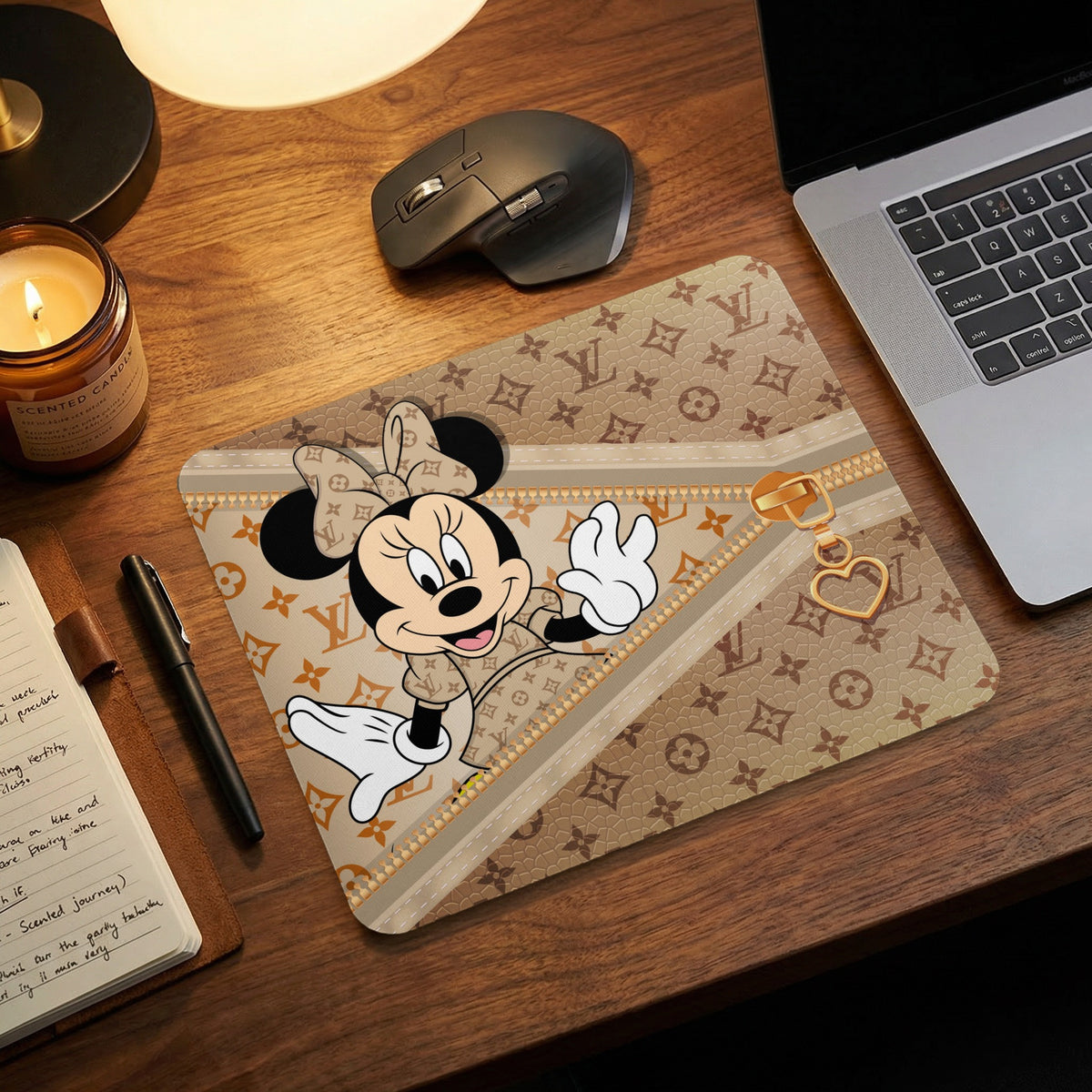 Minnie Mouse mousepad with monogram pattern and gold zipper detail.