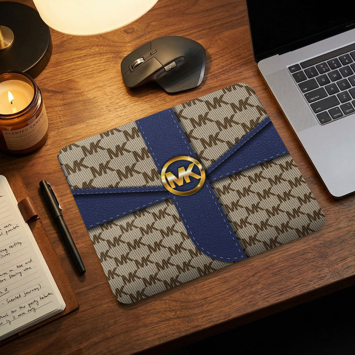 Michael Kors monogram mousepad with gold logo on navy ribbon detail.