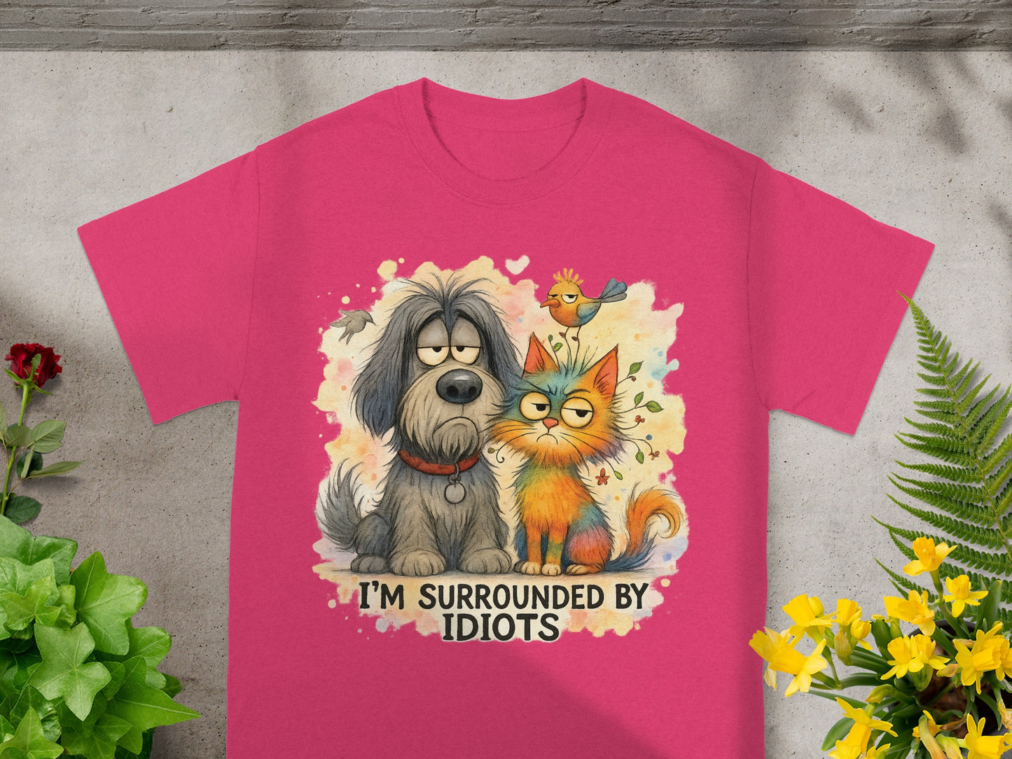 T-shirt with cartoon dog, cat, and bird graphic, reading "I'M SURROUNDED BY IDIOTS".