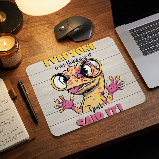 A mousepad featuring a cartoon lizard wearing glasses and the text Everyone was thinking it, I just said it.