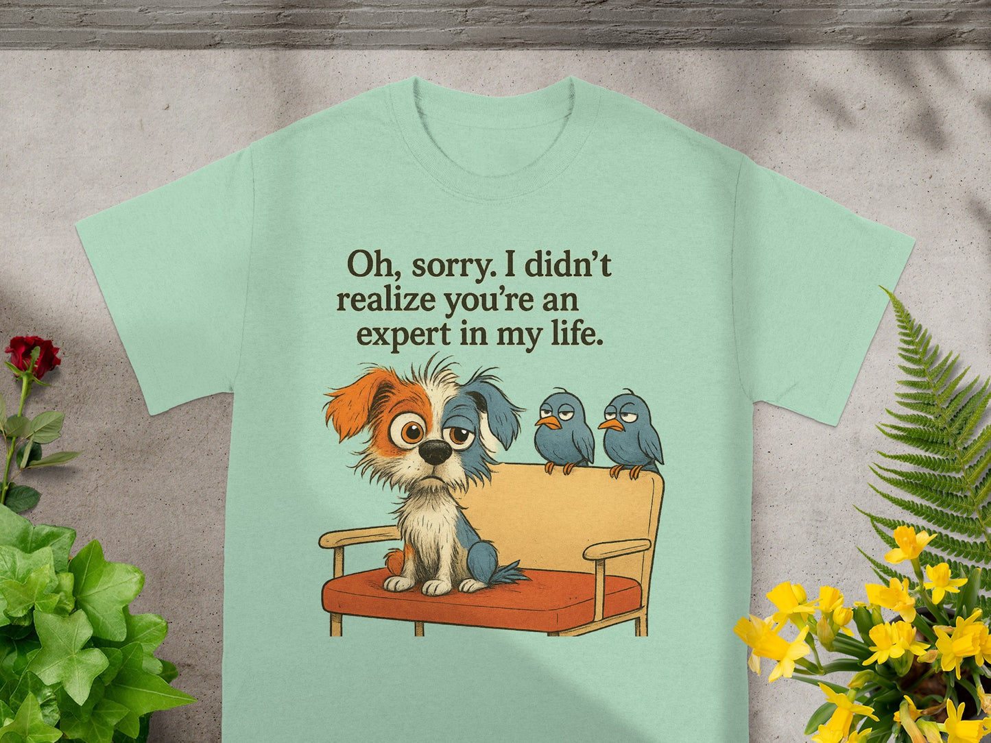 Light green t-shirt with a cartoon dog and three birds on a couch, text reads "Oh, sorry. I didn't realize you're an expert in my life."