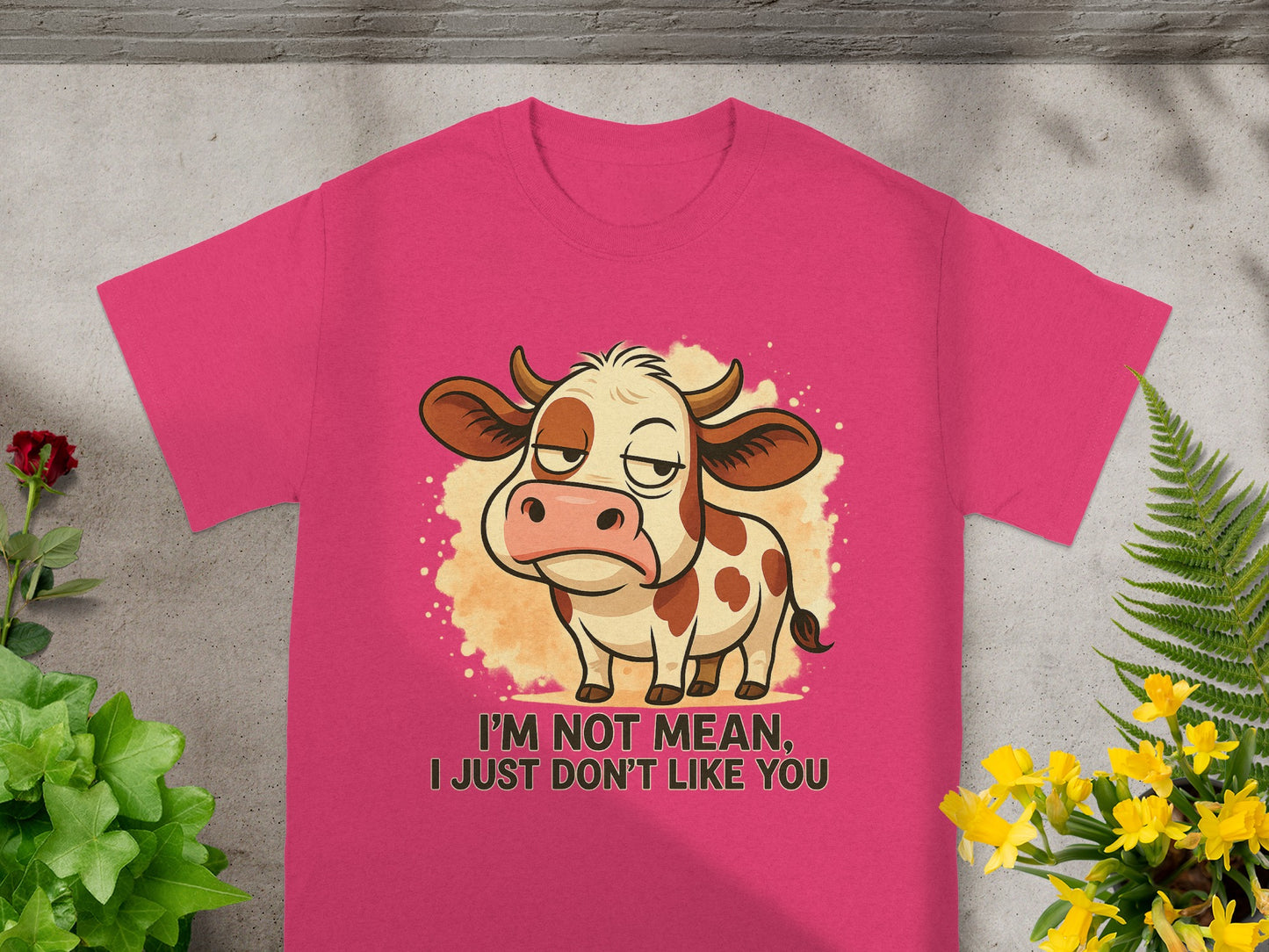 Pink t-shirt with cartoon cow and text "I'm not mean, I just don't like you."