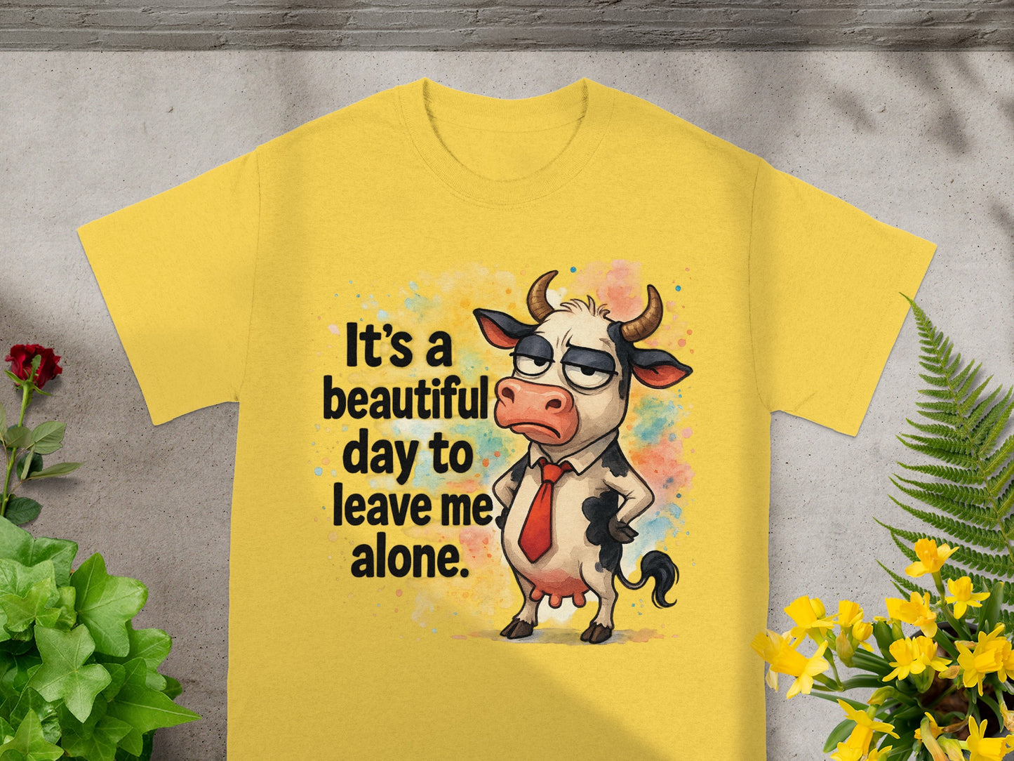 Yellow t-shirt with cartoon cow saying "It's a beautiful day to leave me alone."