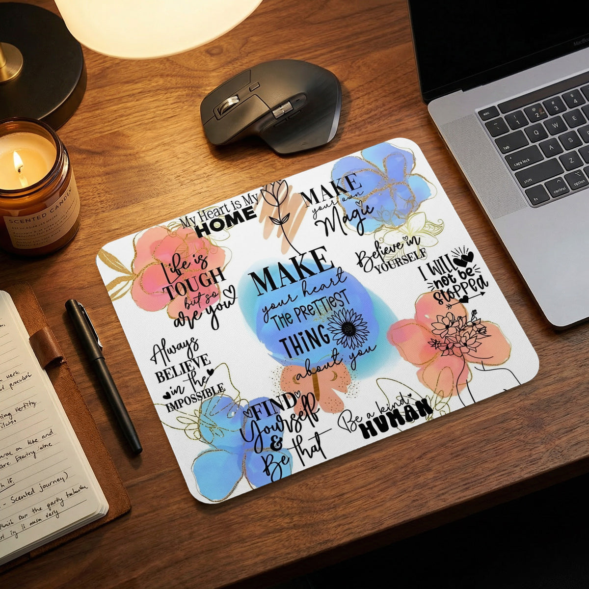 Inspirational quotes and floral watercolor designs on a white mousepad.