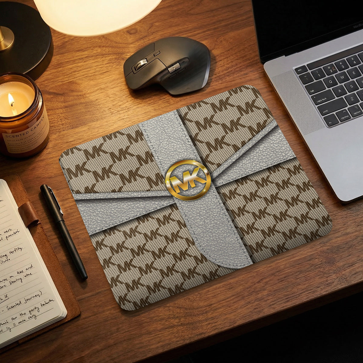 Michael Kors patterned laptop sleeve with a gold MK logo.