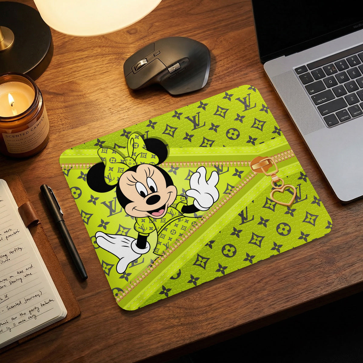 Minnie Mouse on a lime green mousepad with a monogram pattern and gold zipper detail.
