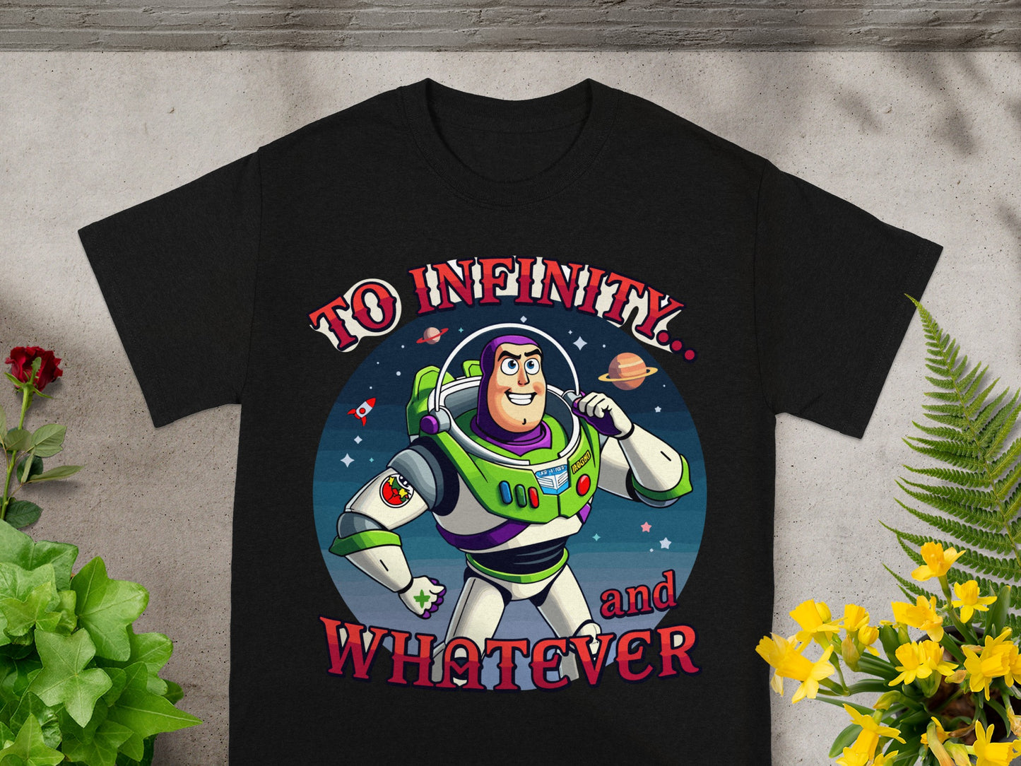 Black t-shirt featuring Buzz Lightyear with text "To Infinity and Whatever".
