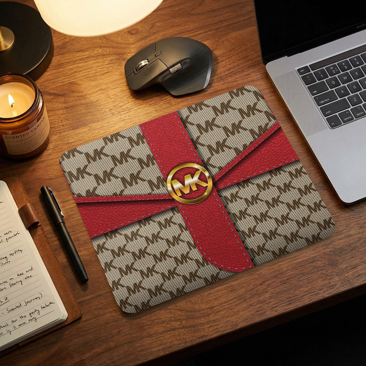 MK logo pattern mouse pad with red ribbon and gold MK emblem.