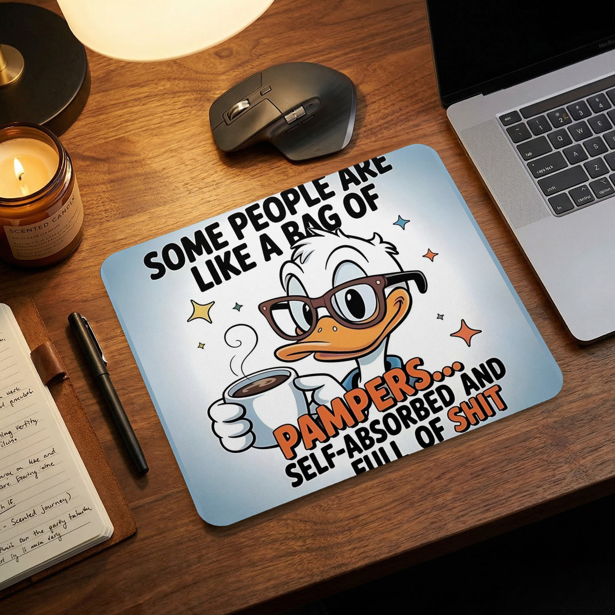 A desk mousepad featuring a cartoon duck holding a coffee mug and humorous text about self-absorption.