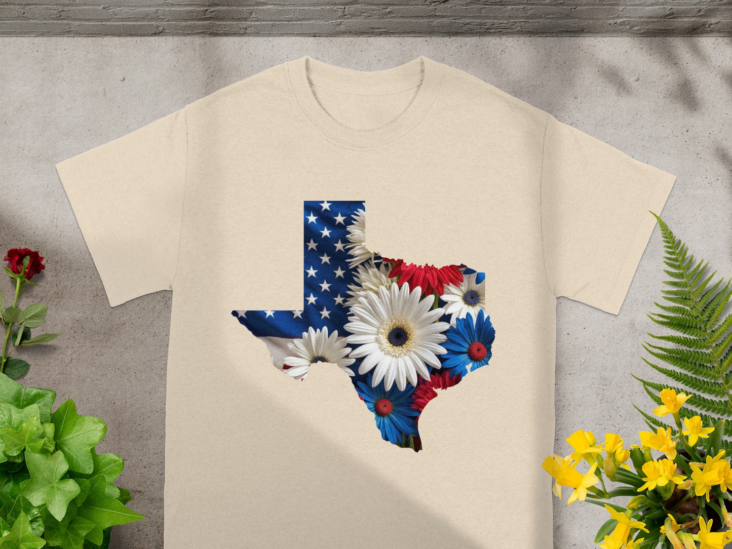 T-shirt with Texas shape filled with American flag and flowers.