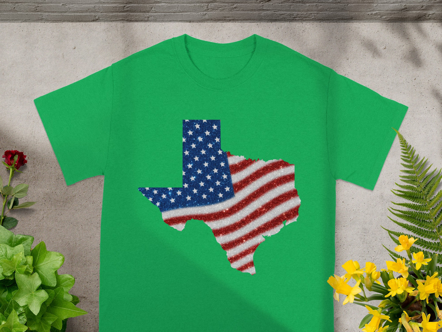 Green t-shirt with Texas shape filled with American flag glitter.