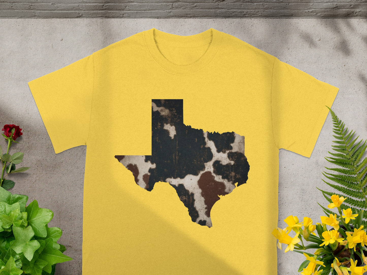 Yellow t-shirt with Texas shape in cowhide pattern.