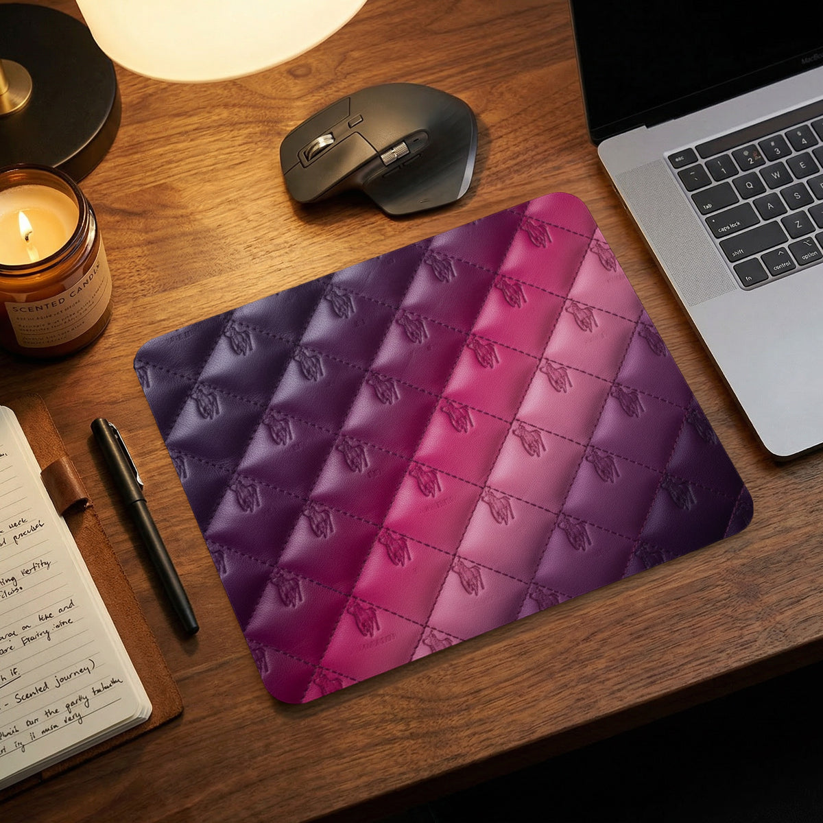 Quilted mousepad with embossed horse logos in purple to pink gradient.