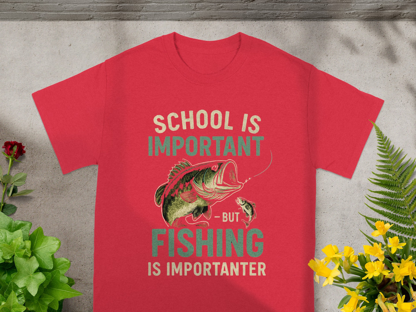 Red t-shirt with "School is important - but fishing is importanter" text and fish graphic.