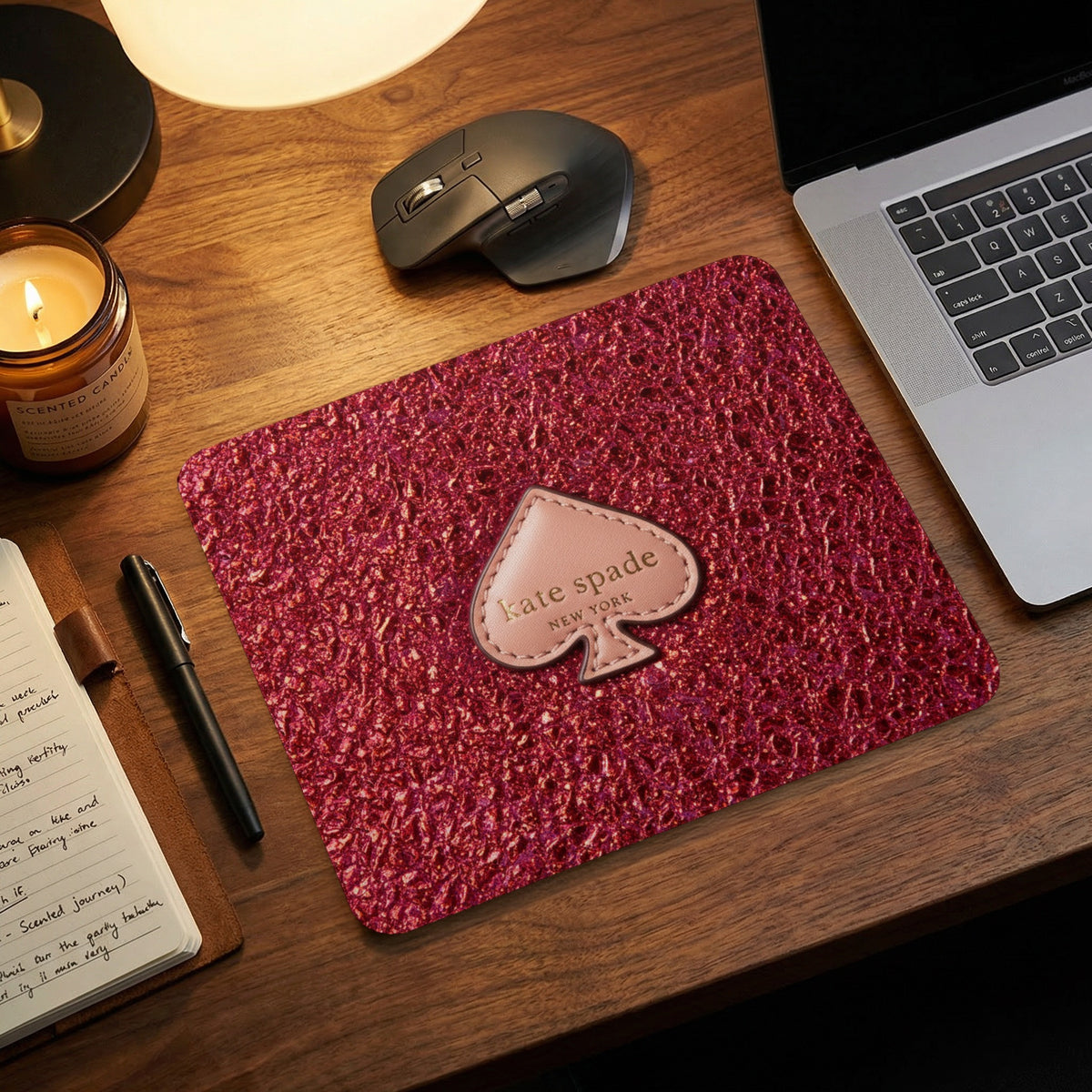 Kate Spade New York mousepad with textured pink surface.