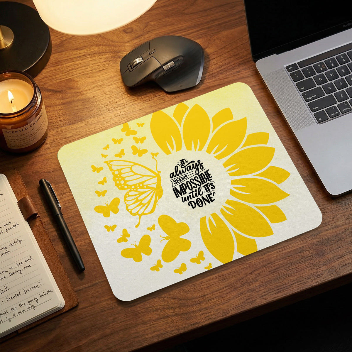 Yellow sunflower and butterfly design mousepad with quote "It always seems impossible until it's done".
