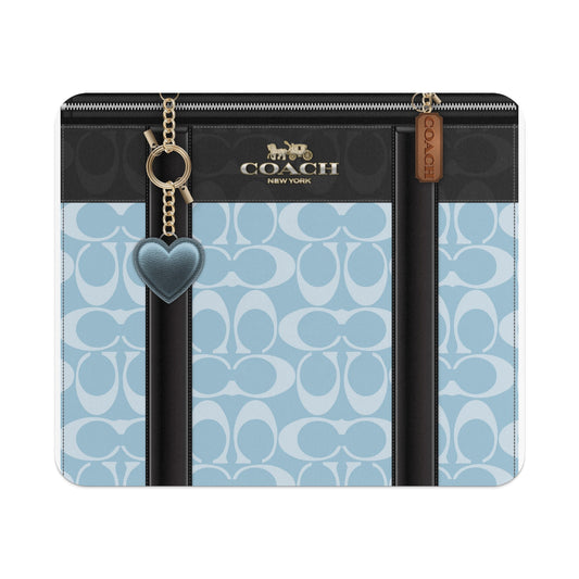 Coach New York wallet with blue monogram pattern and heart charm
