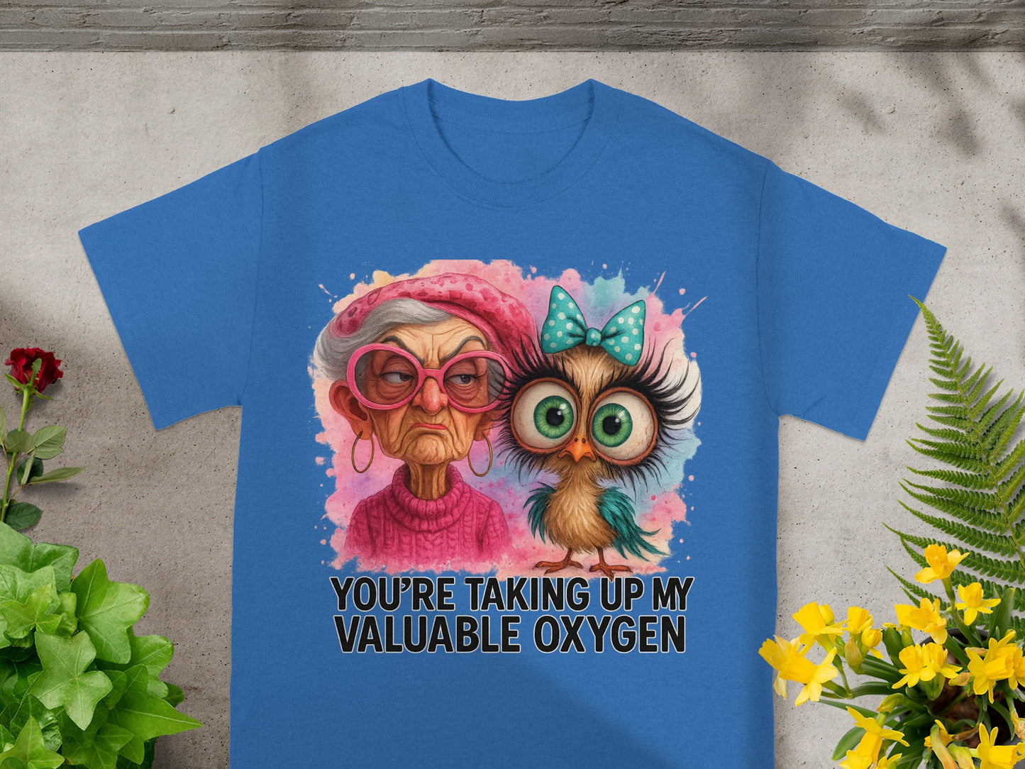 Blue t-shirt with a grumpy woman and owl graphic and text "YOU'RE TAKING UP MY VALUABLE OXYGEN".