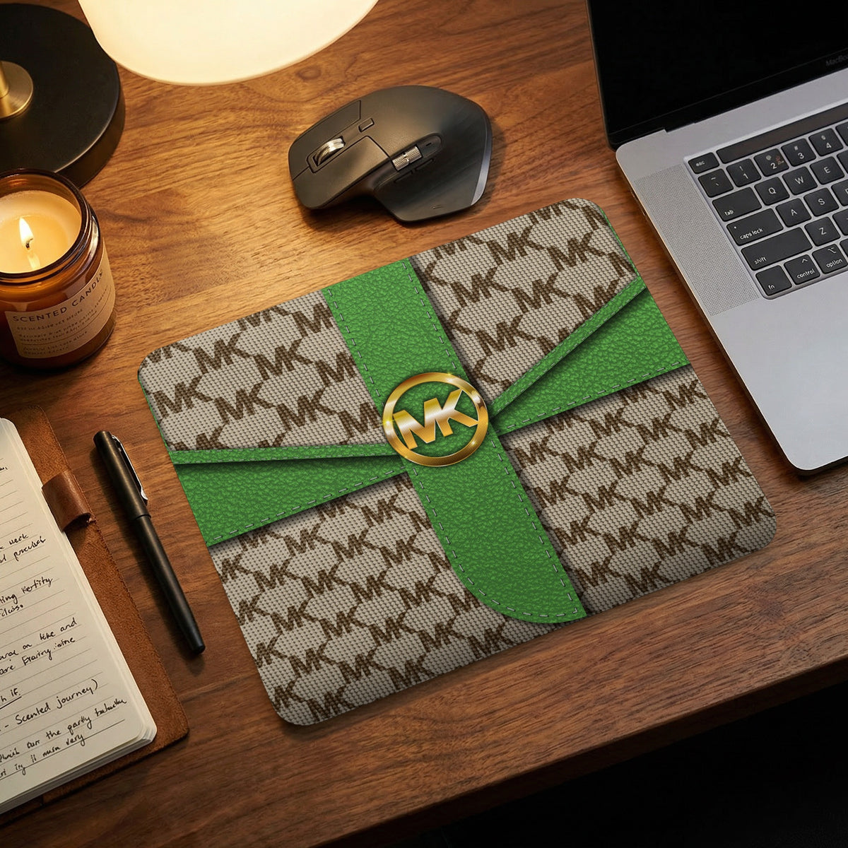 Michael Kors monogram mousepad with green ribbon detail and gold logo.
