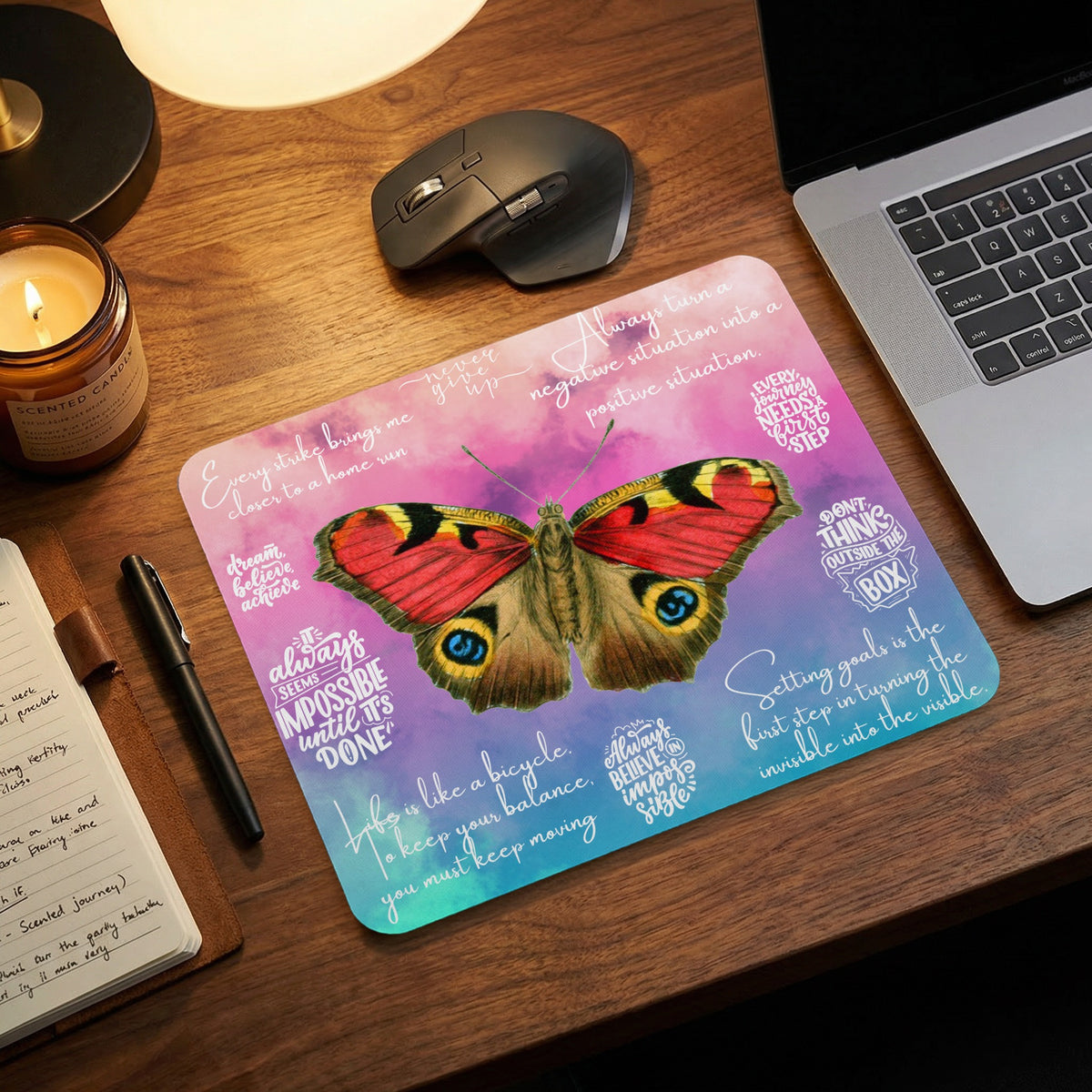 Mousepad with a peacock butterfly and motivational quotes on a pastel background.